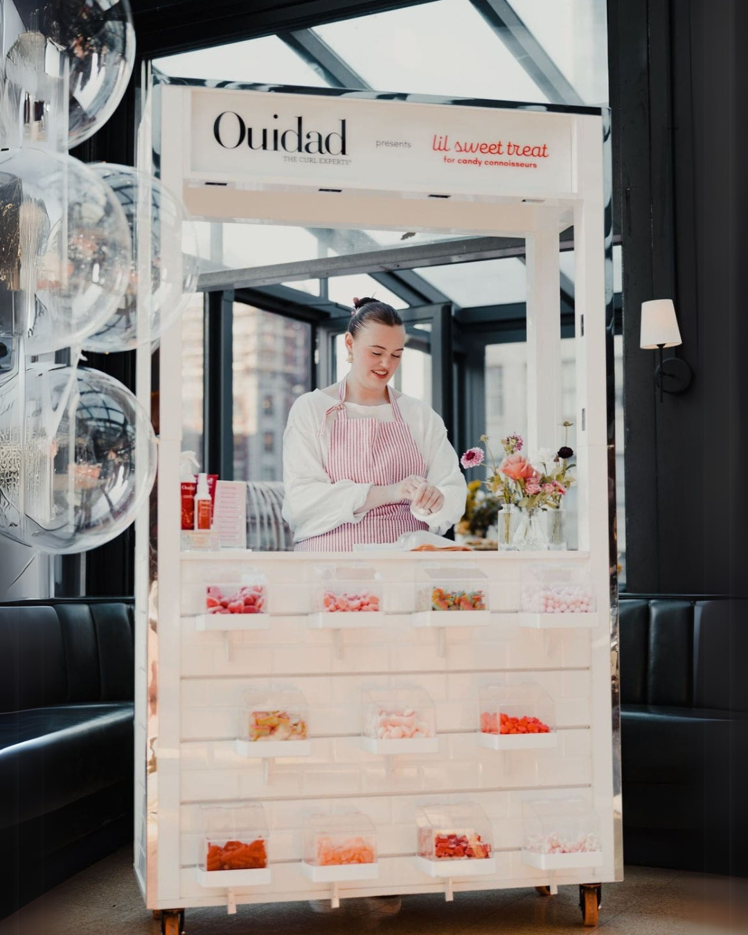 an image of lil sweet treat's candy cart at an Ouidad event