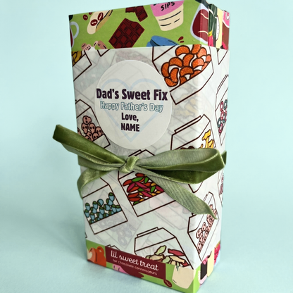 Gift box with colorful design and green ribbon on a light blue background