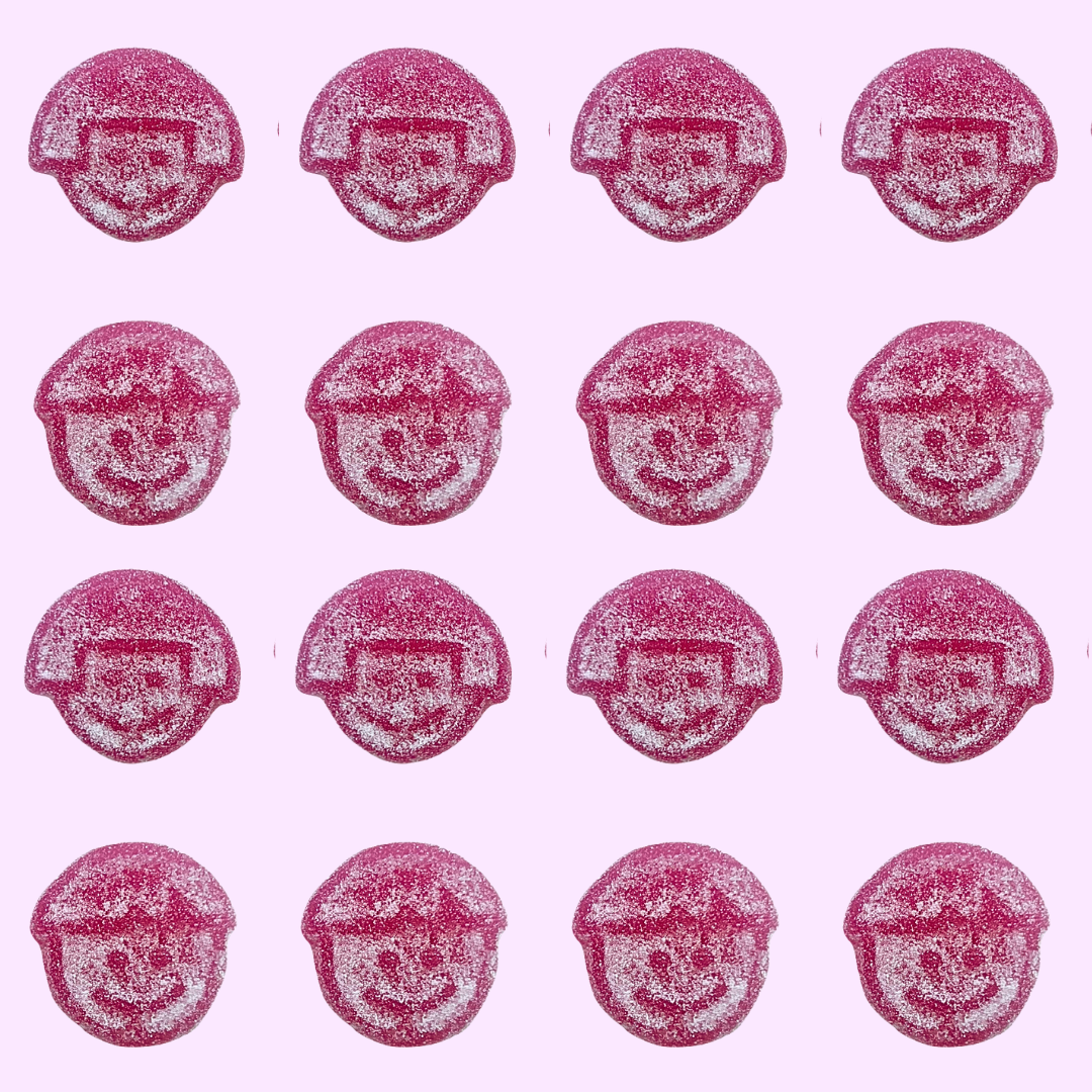 Pink and white jelly faces with smiles players on a pink background