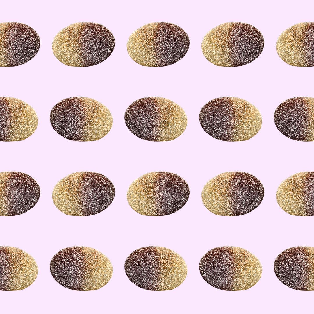 sour cola coins from Sweden on a purple background 